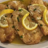 Chicken Francese · Lightly breaded chicken breast fried with lemon sauce served over pasta.