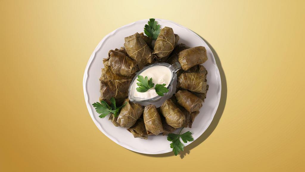 Alluring Grape Leaves · Fresh grape leaves are stuffed with mix of rice, fresh vegetables and herbs, served chilled with a side of homemade yogurt sauce.