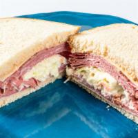 The Dinty Moore Sandwich  · Corned beef and pastrami, Swiss cheese, coleslaw, Russian dressing on rye bread.