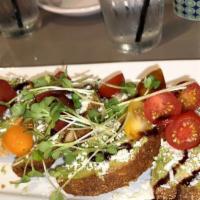 Avocado Toast  · sourdough, heirloom tomato, cotija, radish, pickled red onion, balsamic reduction, sprouts