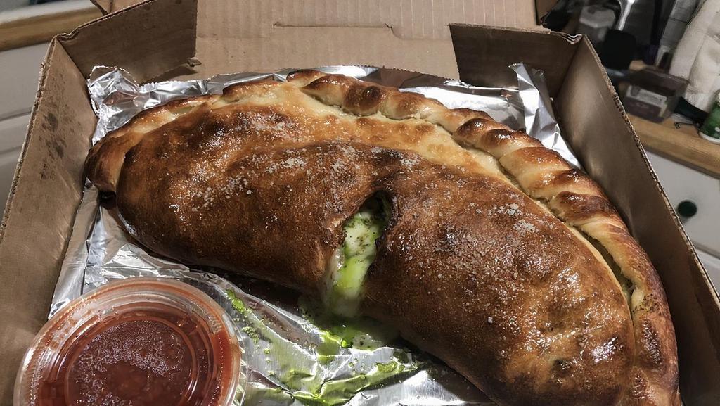 Veggie Calzone
 · Mushrooms, tomatoes, green peppers, onions, spinach, and broccoli.
