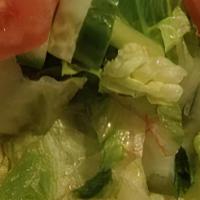 #19. Mixed Greens Salad · Lettuce, cucumber, tomatoes with choice of dressing.