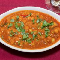 #23. Chana Masala · Mixed vegetables dipped in batter and deep fried.