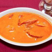 #45. Butter Chicken · Chicken marinated & roasted in clay oven & cooked w/ creamy masala sauce.