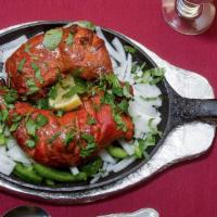 #54. Chicken Tandoori · 2 pcs of chicken legs marinated in yogurt and spices, roasted in oven.