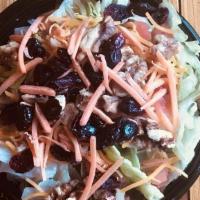 Garden Salad · Halved walnuts, dried cranberries, carrots, shredded cheddar cheese, tomatoes and balsamic v...