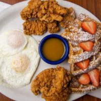 Aunt Dee Waffle · A Belgian waffle served with crispy chicken tenders and two eggs any style.