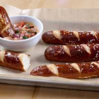 Pretzel Rails & Craft Beer Cheese · Soft-baked pretzels with warm craft beer cheese and pico de gallo.