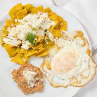 Chilaquiles · Corn tortilla melted with red or green sauce. Includes rice, beans.