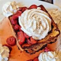 Stuffed French Toast · Redford Grill's french toast combined with our homemade cream cheese-based filling. Topped w...
