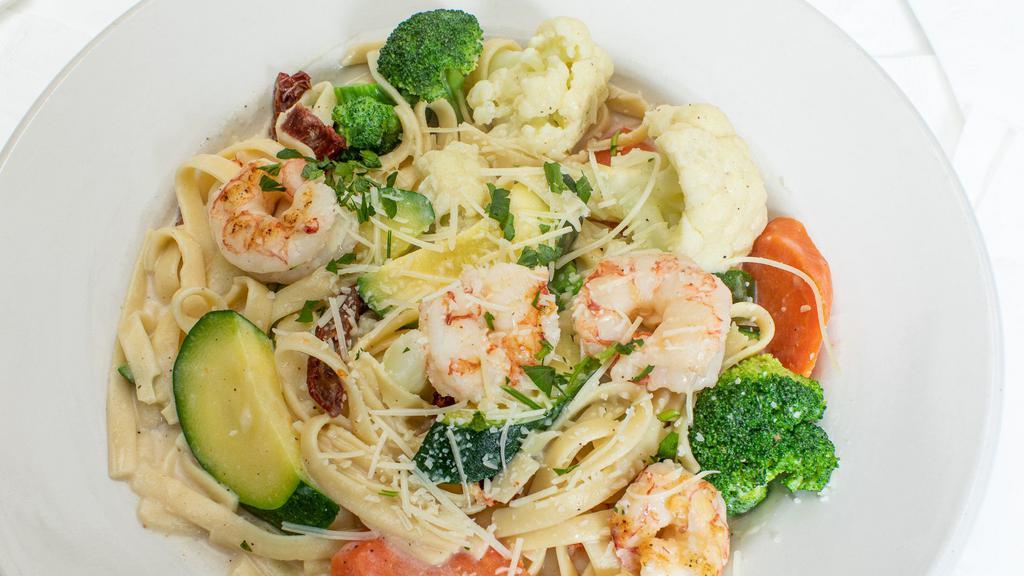 Shrimp Fettuccine · Fresh broccoli, cauliflower, zucchini, carrots and sun-dried tomatoes tossed with whole shrimp and fettuccine in a garlic cream sauce.