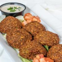 Falafel · Vegan. Ground chickpeas blended with fresh cilantro, parsley, fava beans, onions and Mediter...