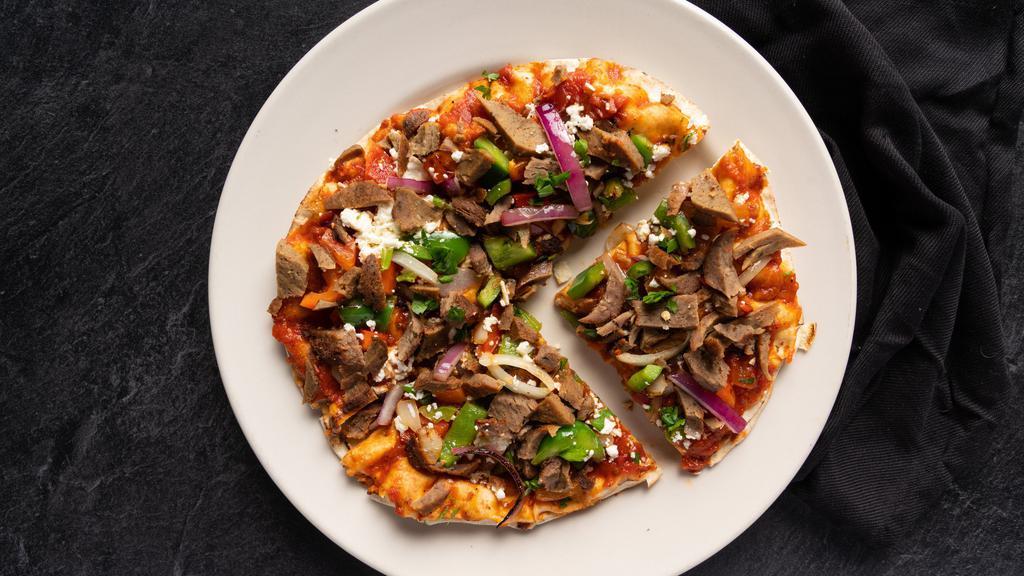 Flatbread Pizzas · Feta cheese, onions, diced tomatoes, banana peppers and our house sauce made with ripe tomatoes, eggplant and onions on top of white or whole wheat flatbread.