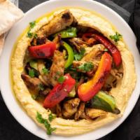 Chicken Shawarma · Sliced chicken seasoned with middle eastern spices and grilled with onions, bell peppers and...
