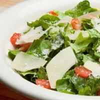 Caesar Salad · Romaine lettuce, tomatoes and shaved parmesan with Caesar dressing and croutons.