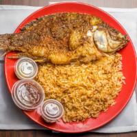 Liberian Dry Rice & Fried Fish · Long grain parboiled rice cooked and mixed with seasoned corned beef, or a blend of luncheon...