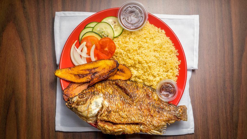 Attieke With Fried Plantain & Fish · Couscous cooked to fluffy perfection and served with fried plantain, a whole seasoned fried fish, and a blend of vegetables.