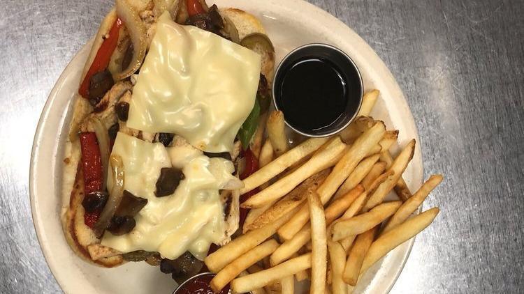 Steak Philly · Juicy pieced of grilled steak with tender sauteed onions, green or red peppers, sauteed mushrooms topped with melted swiss cheese on a hoagie roll served with au jus.