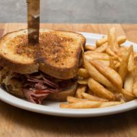 The Reuben · Lean corned beef thinly sliced in house, sauerkraut, thousand island dressing and Swiss chee...