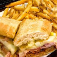 Cuban Sandwich · Thinly sliced ham and Mason's made pulled pork served on a ciabatta bun, topped with melted ...