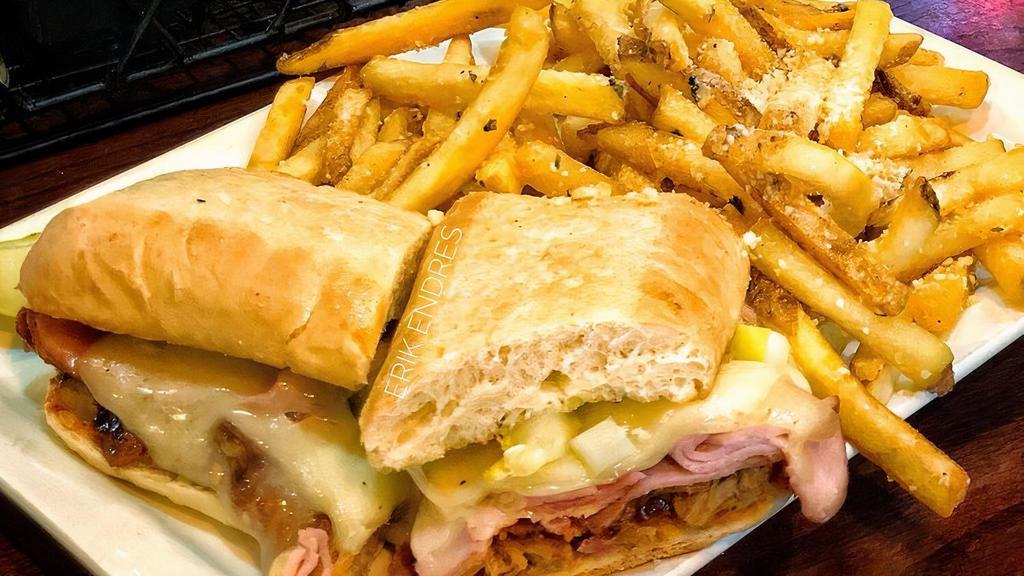 Cuban Sandwich · Thinly sliced ham and Mason's made pulled pork served on a ciabatta bun, topped with melted swiss, mustard and a pickle.