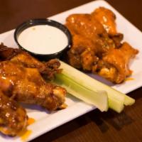 Bone-In Wings · Served by the pound, try them tossed in a sauce of your choice. Served with Blue cheese or r...
