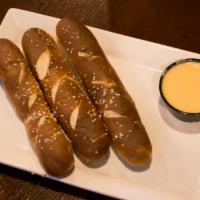 Pretzel Sticks · Three Bavarian pretzels stick served with our delicious Beer cheese sauce.