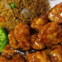 General Tso'S Chicken左鸡 · Each plate with chicken fried rice and egg roll.