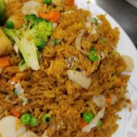 Vegetable Fried Rice · Includes peas, carrots, onion, and eggs.