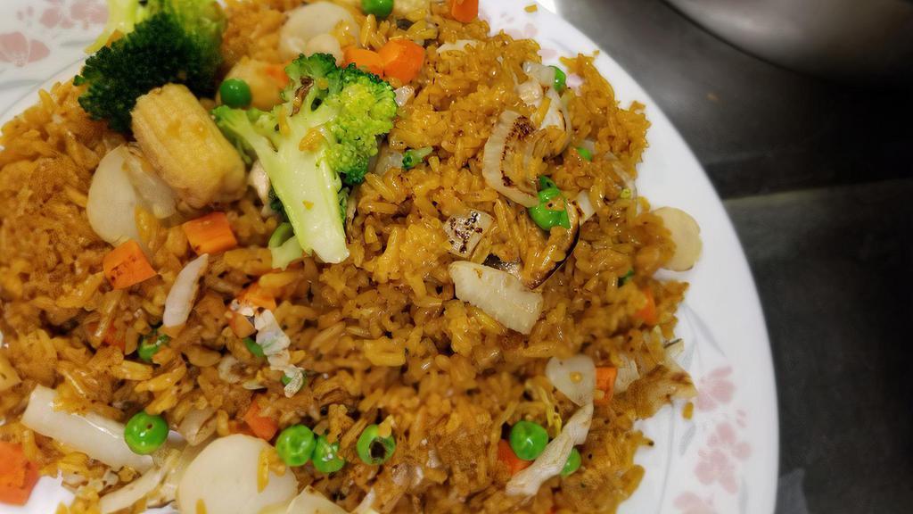 Vegetable Fried Rice · Includes peas, carrots, onion, and eggs.