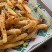 Loaded Magna Fries® · Melted cheddar-jack cheese, bacon and scallions, served with ranch dressing for dipping.