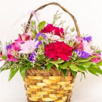Lavender Garden · A brown, wicker basket filled with a garden of pink and lavender blooms.