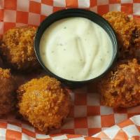 Buffalo Bombs · All white meat chicken breast slow cooked in a house made buffalo and cream cheese sauce bal...