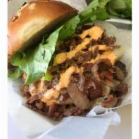 Z Burger · Topped with smoked Gouda cheese, bacon crumbles, lettuce, tomato, pickles, onion and our hom...