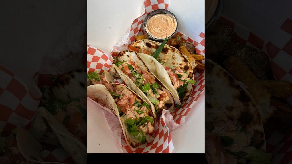 Street Tacos · 3 pieces. Three flour tortillas stuffed with grilled chicken, Jalapeno Cream Cheese, lettuce, tomato, and topped with our Z sauce.