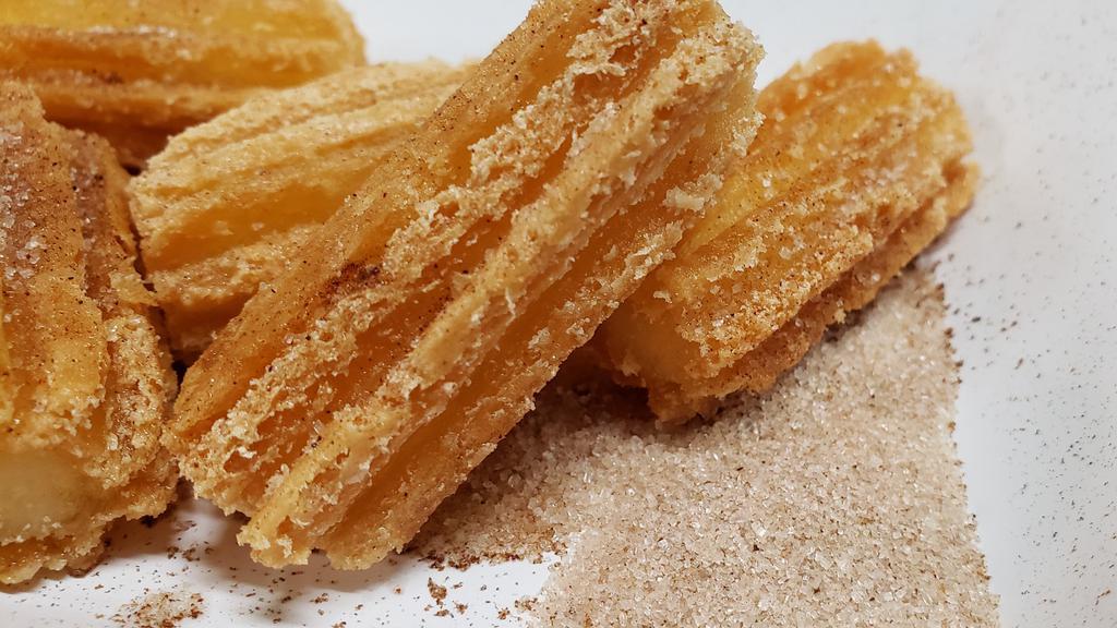 Churro Bites · Fried pastry dusted with cinnamon sugar.