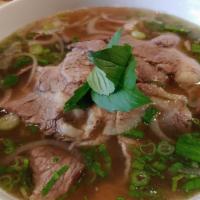 Beef Pho · Premium beef brisket and slices of eye of round beef with white onion, green onion, and basi...