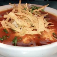 Azteca Chicken Tortilla Soup · Pulled chicken in a chipotle chicken broth, garnished with avocado, queso chihuahua, cilantr...