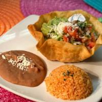 Taco Salad · Pan fried crisp tortilla shell with a spread of refried beans and choice of filling. Topped ...