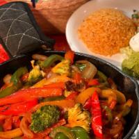 Vegetarian Fajitas · Red, yellow, and green peppers sautéed with broccoli, mushrooms, onions and tomatoes. Served...