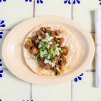 Lengua Taco · Beef tongue. Lettuce, tomato, sour cream, cheese and hot sauce. 
 Cilantro and onion is cust...