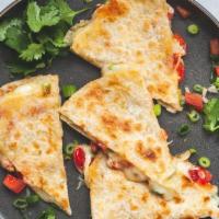 Flour Quesadilla · 12' Toasted flour tortilla folded in half with melted cheese and your favorite meat. Served ...