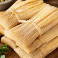 Tamale · Home-made fresh masa/dough steamed in a corn husk or banana leaf and filled with various ing...