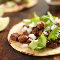 4 Taco Combo · 4 corn tacos with your choice of meat, topped with cilantro and onions. Limes on the side.Ch...