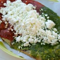 Huarache · A thick toasted oval shape hand-made corn tortilla spread with pinto beans. Topped with sals...