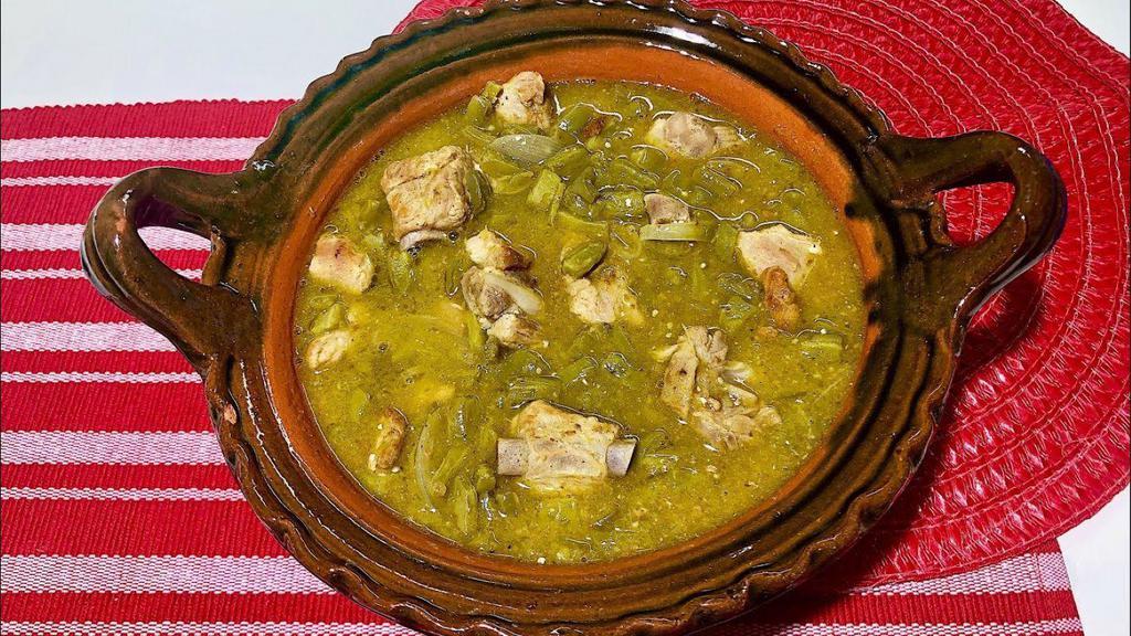 Puerco En Salsa Verde · Pork tenderloin cooked in a homemade medium spicy tomatillo salsa with cactus and potatoes. Tortillas, rice and beans on the side.
