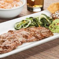 Tampiquena · New York grilled steak served with two cheese enchiladas; Veggies, tortillas and mashed pota...
