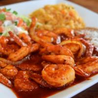 Camarones Al Gusto · Shrimp made to your taste. Rice and salad on the side.