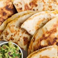 Fajita Quesadilla · 12’’ Toasted flour tortilla folded in half with melted cheese inside and onions, red and gre...