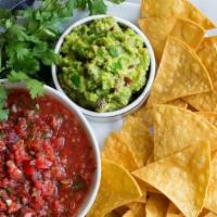 Chips & Guacamole · Crunchy homemade corn tortillas cut into triangles and fried. Paired best with one of our ho...